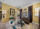 Well-decorated living room with a fireplace, views of the pool and lots of natural light at 1111 Carriage Park Dr, Valrico, FL 33594