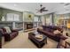 Cozy living room showcases a fireplace, built-in shelves, and comfortable seating for relaxing and entertaining at 1111 Carriage Park Dr, Valrico, FL 33594