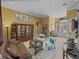 Bright living room with elegant décor, arched doorways and tile flooring at 1111 Carriage Park Dr, Valrico, FL 33594