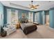 This spacious main bedroom boasts a cozy sitting area, providing a relaxing retreat at 1111 Carriage Park Dr, Valrico, FL 33594