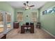 Bright office space with ample natural light and a view of the pool, ideal for a productive work environment at 1111 Carriage Park Dr, Valrico, FL 33594