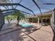 Enjoy outdoor living in this screened pool area with spa and brick patio at 1111 Carriage Park Dr, Valrico, FL 33594