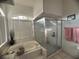 Bathroom with a soaking tub and separate glass shower at 1530 Davenport Dr, New Port Richey, FL 34655