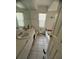 Bathroom with a single vanity, tile flooring, and a bathtub to the right of the toilet at 1530 Davenport Dr, New Port Richey, FL 34655