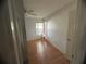 Bedroom with hardwood floors, a single window, and a ceiling fan at 1530 Davenport Dr, New Port Richey, FL 34655