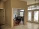 Entryway with double doors, wood and tile floors, and interior view at 1530 Davenport Dr, New Port Richey, FL 34655