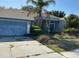 Single-Gathering home featuring a two-car garage and drought landscaping at 1530 Davenport Dr, New Port Richey, FL 34655