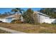 Single-Gathering home with a two-car garage and side yard at 1530 Davenport Dr, New Port Richey, FL 34655