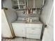 Laundry room featuring a washer and dryer and storage cabinets at 1530 Davenport Dr, New Port Richey, FL 34655
