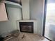 Living room with tile flooring, a fireplace, and a door to the outside at 1530 Davenport Dr, New Port Richey, FL 34655