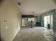 An empty living room with tile floor, ceiling fan, and fireplace at 1530 Davenport Dr, New Port Richey, FL 34655