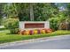 Aquatic Club sign surrounded by colorful foliage and lush greenery; welcomes residents and visitors at 15555 Martinmeadow Dr, Lithia, FL 33547