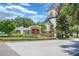 Welcoming entrance to FishHawk Ranch with stone signage, beautiful landscaping, and architectural detail at 15555 Martinmeadow Dr, Lithia, FL 33547
