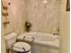 Elegant bathroom featuring a bathtub, tiled walls, and accessibility features at 1655 S Highland Ave # J193, Clearwater, FL 33756