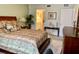 Spacious bedroom with large bed, dresser, and adjacent to a bathroom at 1655 S Highland Ave # J193, Clearwater, FL 33756