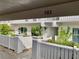 Charming condo exterior showcasing well-maintained landscaping, a white fence, and the unit number, 193 at 1655 S Highland Ave # J193, Clearwater, FL 33756