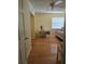 Bright, sunny bedroom features hardwood floors, a ceiling fan, and ample space at 1735 Tall Pine Cir, Safety Harbor, FL 34695