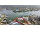 Aerial view of the property with private boat dock, offering convenient waterfront living at 1897 Clearwater Harbor Dr, Largo, FL 33770