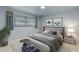 This bedroom has a gray bed frame, light blue walls, and hardwood flooring at 1903 Oro Ct, Clearwater, FL 33764
