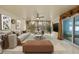This living room has stone accent wall, large couch, and designer décor at 1903 Oro Ct, Clearwater, FL 33764
