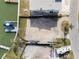 Aerial view showcasing vacant lot with dock and canal, highlighting waterfront living at 211 Bath Club N Blvd, North Redington Beach, FL 33708