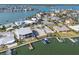 Aerial view showcasing the prime location of vacant lot, waterfront access, dock, and community at 211 Bath Club N Blvd, North Redington Beach, FL 33708