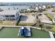 Waterfront lot featuring a boat dock, lift and boat, ready for your new custom home at 211 Bath Club N Blvd, North Redington Beach, FL 33708