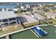 Aerial view of vacant lot with boat dock, waterfront access, and proximity to community amenities at 211 Bath Club N Blvd, North Redington Beach, FL 33708