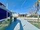 Dock extends to a waterfront house with screened-in porch, boat lift, and private outdoor space at 211 Bath Club N Blvd, North Redington Beach, FL 33708