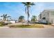 View of waterfront lot and adjacent home from the street at 211 Bath Club N Blvd, North Redington Beach, FL 33708