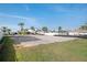 Spacious vacant lot, prepped for construction, surrounded by lush landscaping and a privacy fence at 211 Bath Club N Blvd, North Redington Beach, FL 33708