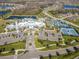 Aerial view of community clubhouse, with tennis courts, pool and generous parking at 4748 Ballast Crest Cv, Land O Lakes, FL 34638
