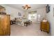 A spacious bedroom with a ceiling fan and a window with curtains at 4748 Ballast Crest Cv, Land O Lakes, FL 34638