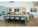 Cafe area with granite countertops, bar stools, and television display at 4748 Ballast Crest Cv, Land O Lakes, FL 34638