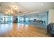 Expansive event space with modern lighting, hardwood floors, and large windows at 4748 Ballast Crest Cv, Land O Lakes, FL 34638