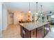 Bright kitchen with granite counters, stainless appliances, and large center island at 4748 Ballast Crest Cv, Land O Lakes, FL 34638