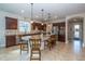 Spacious kitchen with granite countertops, large island, stainless appliances, and dark wood cabinets at 4748 Ballast Crest Cv, Land O Lakes, FL 34638