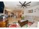 Open-concept living space with kitchen, dining, and living areas for easy entertaining at 4748 Ballast Crest Cv, Land O Lakes, FL 34638