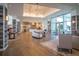 Inviting lobby with modern decor, hardwood floors, and ample seating areas at 4748 Ballast Crest Cv, Land O Lakes, FL 34638