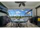 Spacious screened-in patio with outdoor dining area and view of the pool at 4748 Ballast Crest Cv, Land O Lakes, FL 34638