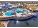 Aerial view of the community pool and amenity center, with lake view at 4748 Ballast Crest Cv, Land O Lakes, FL 34638