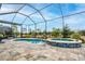 Inviting screened-in pool and spa area for year-round outdoor enjoyment at 4748 Ballast Crest Cv, Land O Lakes, FL 34638