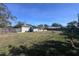 Large backyard with a wooden fence, providing ample space for outdoor activities at 6044 6Th N Ave, St Petersburg, FL 33710