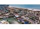 Aerial view of waterfront home near the beach with lush landscaping, boat docks, and proximity to restaurants at 11721 1St E St, Treasure Island, FL 33706