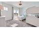 Bright bedroom with a large window leading to a balcony and a cozy carpet at 11721 1St E St, Treasure Island, FL 33706