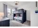 Nautical themed bedroom with a bunk bed, soft carpet, and windows with curtains at 11721 1St E St, Treasure Island, FL 33706