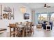 Cozy dining area with coastal decor, natural light, and an adjacent living space at 11721 1St E St, Treasure Island, FL 33706