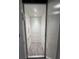 Modern elevator with tiled floor and recessed lighting at 11721 1St E St, Treasure Island, FL 33706