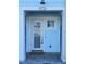 Inviting entryway featuring a decorative wreath and charming coastal accents on the front door at 11721 1St E St, Treasure Island, FL 33706