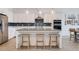 Beautiful kitchen with white cabinetry, stainless steel appliances, and a functional center island at 11721 1St E St, Treasure Island, FL 33706